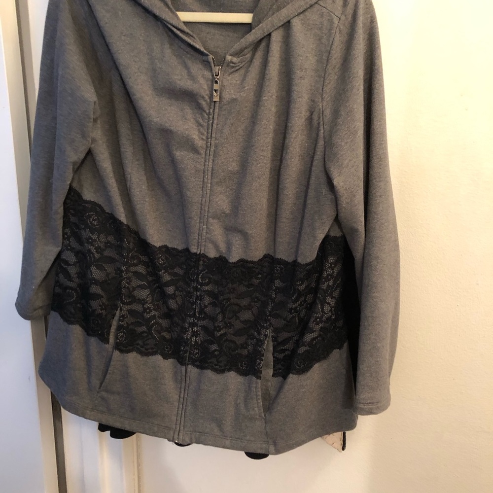 grey jacket with black lace inset and hood